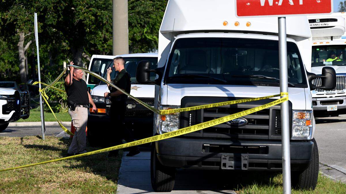 Law enforcement personnel investigate the scene of a shooting that happened around 3:30 a.m. Friday, May 24, 2024. The Manatee County Sheriff’s Office says Sean Calcutti is charged with attempted murder after he tried to break into a nursing home and shot a deputy in the arm.