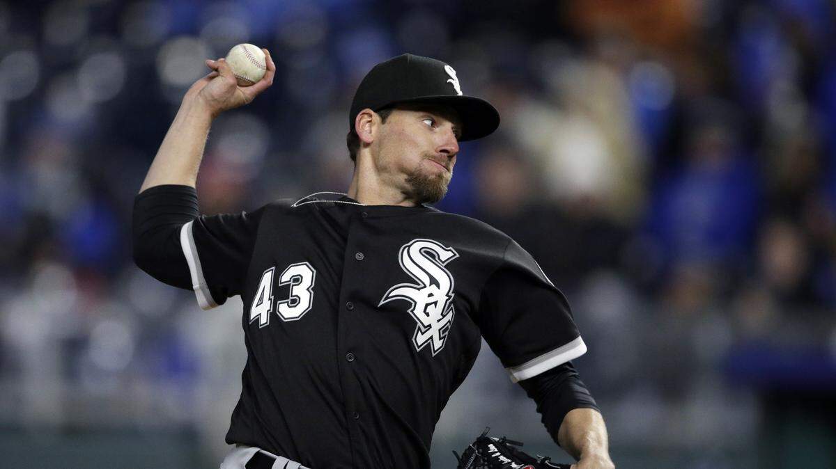 FILE - In this March 31, 2018, file photo, Chicago White Sox relief pitcher Danny Farquhar throws during the team's baseball game against the Kansas City Royals at Kauffman Stadium in Kansas City, Mo. Minnesota Twins' Logan Morrison and Jake Odorizzi were encouraged after visiting former teammate Farquhar in the hospital Friday, May 4. Morrison was “really blown away” at how well Farquhar was doing after collapsing in the dugout with a ruptured aneurysm on April 20. Odorizzi says when he walked into the room at Rush University Medical Center, Farquhar stood from a couch and hugged him.