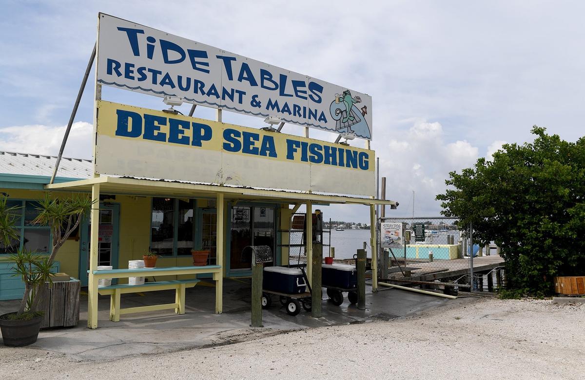 Tide Tables restaurant at the foot of the Cortez Bridge, first closed their outside tables to protect the employees and visitors from the effects of red tide, then closed completely for a deep cleaning.