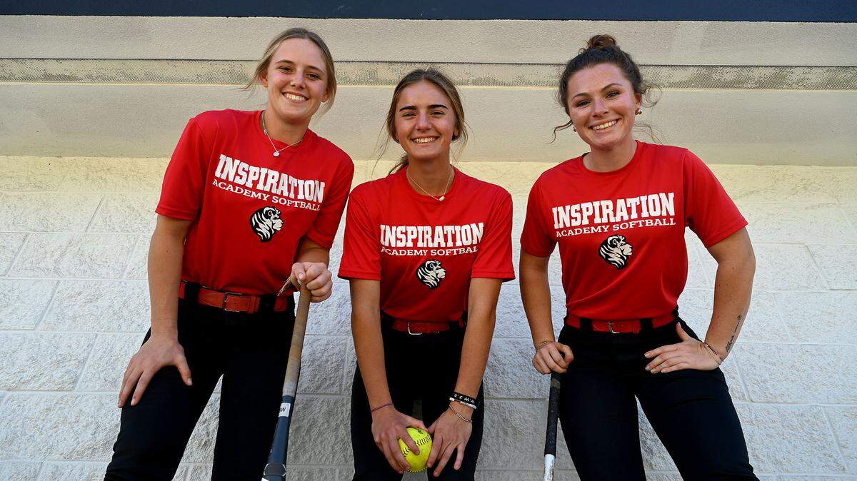 Avery Bouquin, 17, Jade Carnahan, 16, and Danika Best, 18, of Inspiration Academy’s softball team.