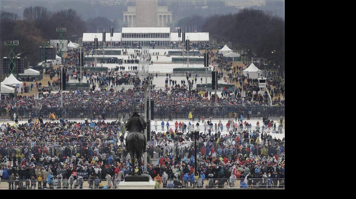 Crowds fill in along the National Mall before the swearing in of Donald Trump as the 45th president of the United States on Friday at the U.S. Capitol in Washington.