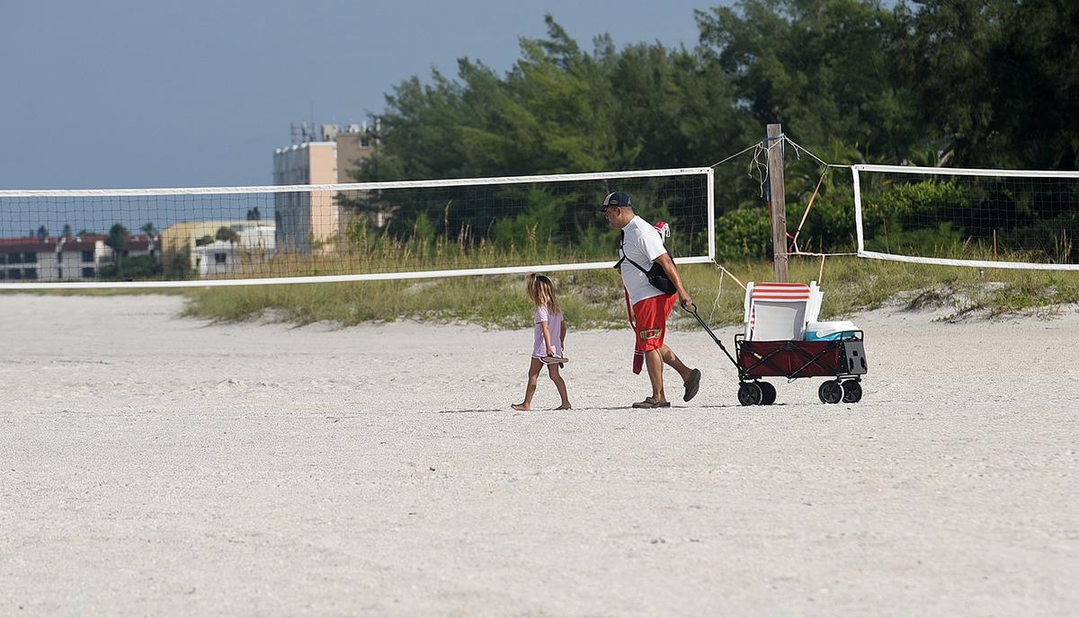 Red tide has hit area businesses hard, keeping crowds away from the island. But owners have hopes that Labor Day weekend business will be strong. A family arrives at the Manatee Public Beach Thursday morning, with barely any other beach-goers.