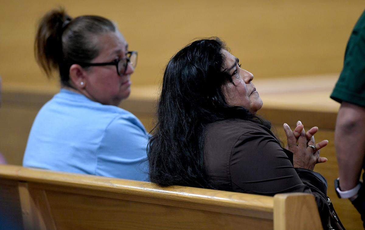 01/19/2022—Elizabeth Pantaleon, brown shirt, cries as she speaks with a victim’s advocate in court during the video first appearance the man who is charged with the murder of her husband. Ruben Gutierrez Pioquinto is facing murder charges after the Manatee County Sheriff’s Office says he shot a man dead and dumped his body by the side of the radon 77th Street East in Palmetto.