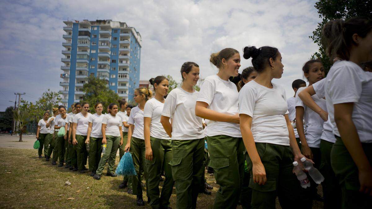 Military academy cadets line up before a practice session at the Latinoamericano stadium where a friendly game will be played on March 22 between the Cuban national baseball team and the Tampa Bay Rays, in Havana, Cuba, Friday, March 18, 2016. U.S. President Barack Obama will travel to the communist island March 20. During his three-day trip, the first to the country by a sitting president in nearly 90 years he will meet with President Raul Castro at the Palace of the Revolution and attend the baseball exhibition game. (AP Photo/Ramon Espinosa)
