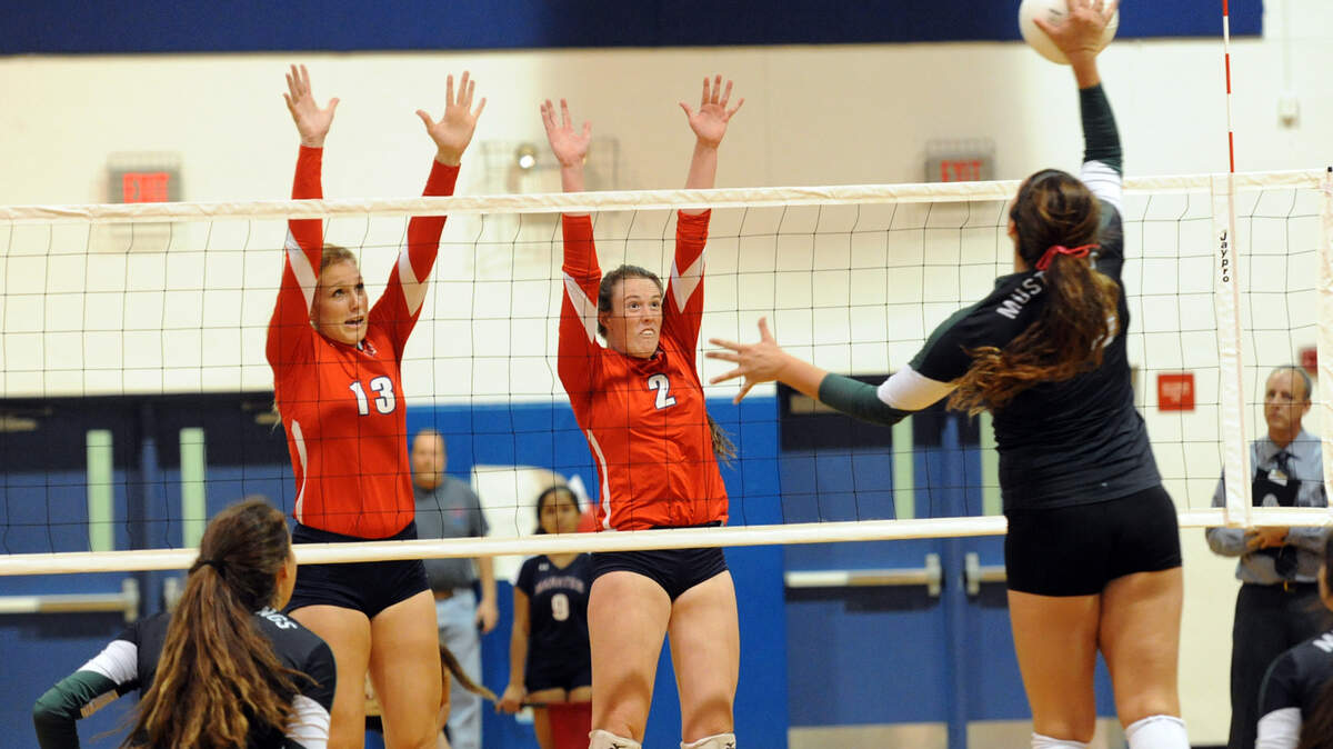 Manatee's Jacqui Armer and Hailey Coulter jump to block Lakewood Ranch's Kahlee York Thursday night at Manatee. 
 TIFFANY TOMPKINS-CONDIE/Bradenton Herald
