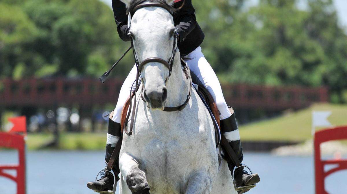 Anna Maliszewska of the Poland navagates a jump in the UIPM Modern Pentathlon combined event Sunday May 8, 2016 at Nathan Benderson Park in Sarasota. TOM HUBBARD/Special to the Herald
