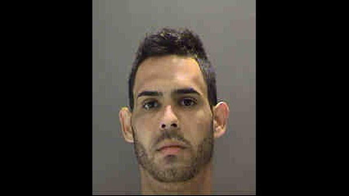 Ransiel F. Pages-Cajuso, 27, of Miami, was  charged with two counts of aggravated assault and one count of possession of a firearm by a convicted felon.
