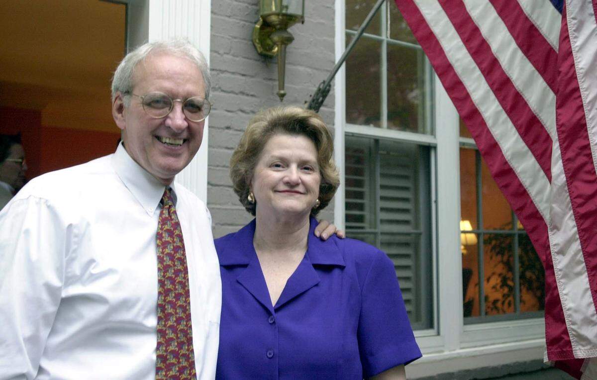 Rep. Dan Miller hosts students from high schools in his district at a reception in his home Monday, May 22, 2000. Miller and his wife Glenda ae shown in front of their Washington home.