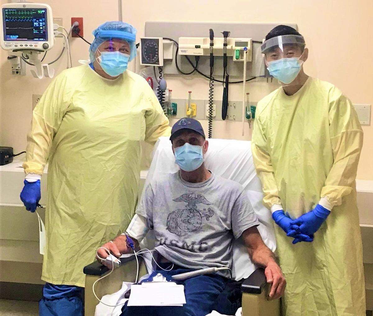 St. Petersburg General Hospital successfully performed its first Monoclonal Antibody Therapy IV treatment in December for  the early onset of COVID-19. Shown above are nurse Kandice Williams (left) and Dr. Vinson Huynh with  patient Harry (center) on Dec. 9  The outpatient IV treatment is approved by the FDA for patients at high risk. The treatment is available at Blake Medical Center.