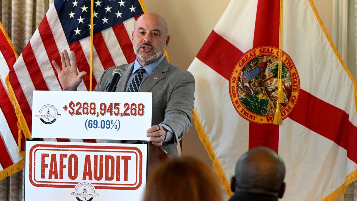 Florida’s Chief Financial Officer, Blaise Ingoglia, held a press conference at Pier 22 in Bradenton to announce what state leaders have called wasteful Manatee County Government spending on Thursday, Oct. 16, 2025. Ingoglia holds up a placard that he says shows how the county’s general fund budget has increased nearly $269 million in five years.