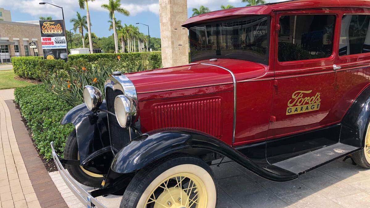 5/5/2021--A hiring sign and a Model A Ford are parked outside the new Ford’s Garage restaurant in the University Town Center District. The restaurant, and may other businesses, will be seeking to add staff at a hiring fair Tuesday, May 11, at 125 N. Cattlemen Road, Unit 101.
