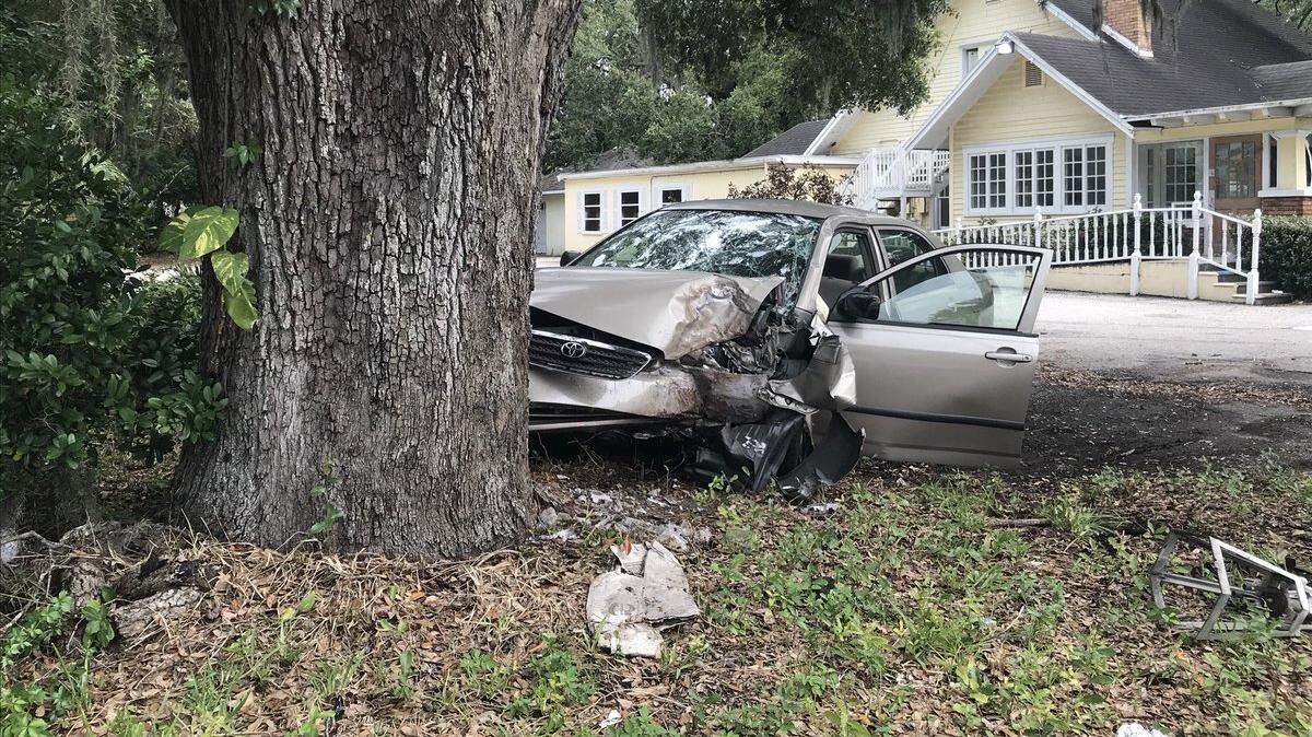 A lane is blocked on eastbound Manatee Avenue after a car crashed into a tree on Monday afternoon.