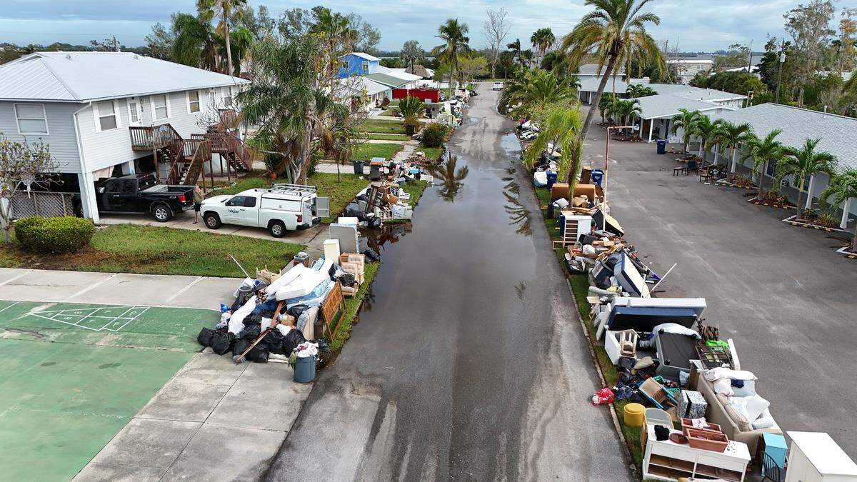 Debris from Hurricane Helene lines the sides of 117th Street in Sunny Shores as Hurricane Milton approaches Manatee County on Oct. 8, 2024.