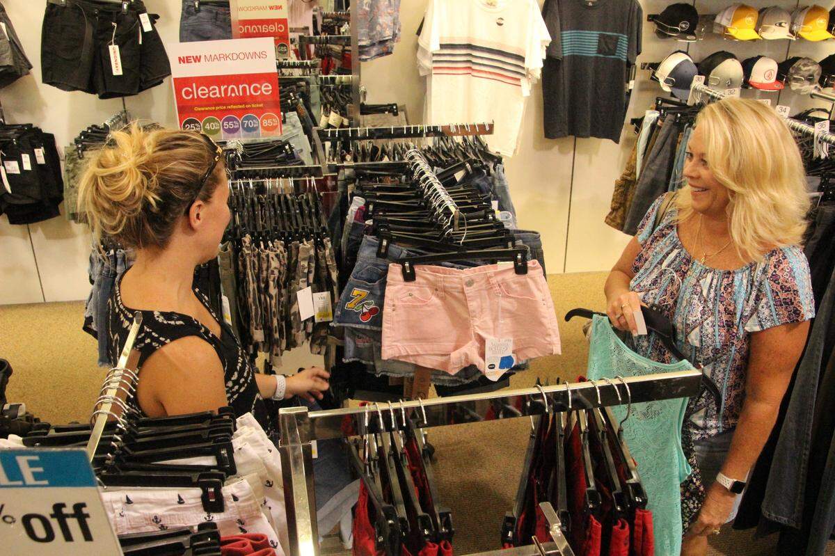 Shoppers take advantage of tax-free holiday sales at Bealls in this Herald file photo. It is unknown when the iconic Florida company will be able to reopen its stores.