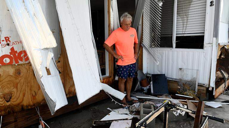 Why is it taking Manatee County so long to distribute hurricane relief funds?