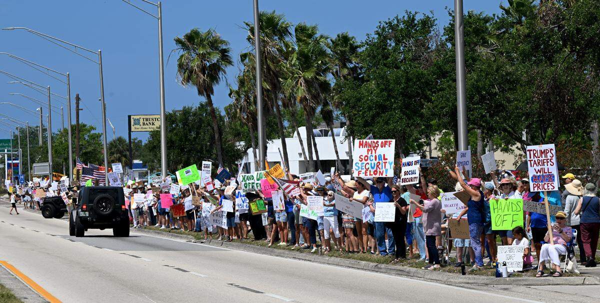 Hundreds of protestors gathered Saturday, April 5, 2025, on Cortez Road West in one of the many national “Hands off” protests against President Donald Trump’s policies.