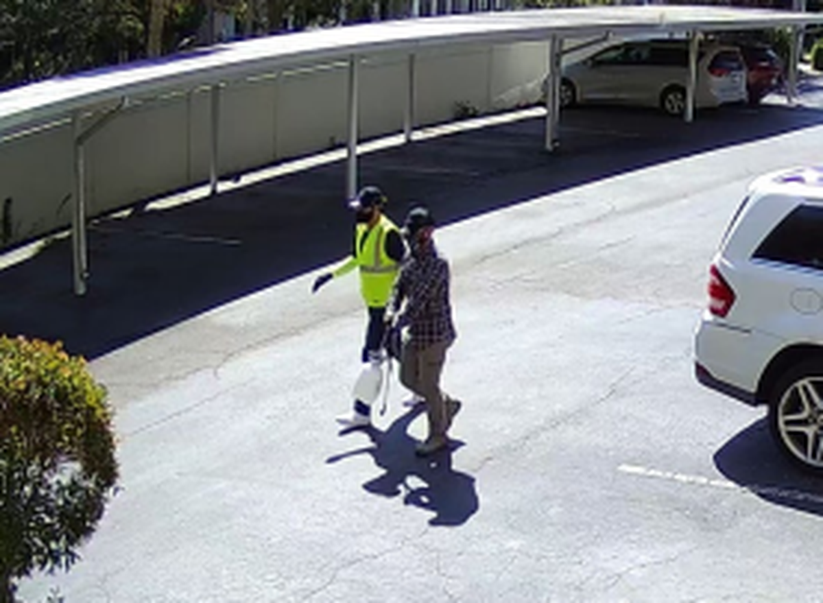 Two men wearing gloves and masks act as pest control and burglarize multiple condominium homes in Bradenton 2,25,2022.