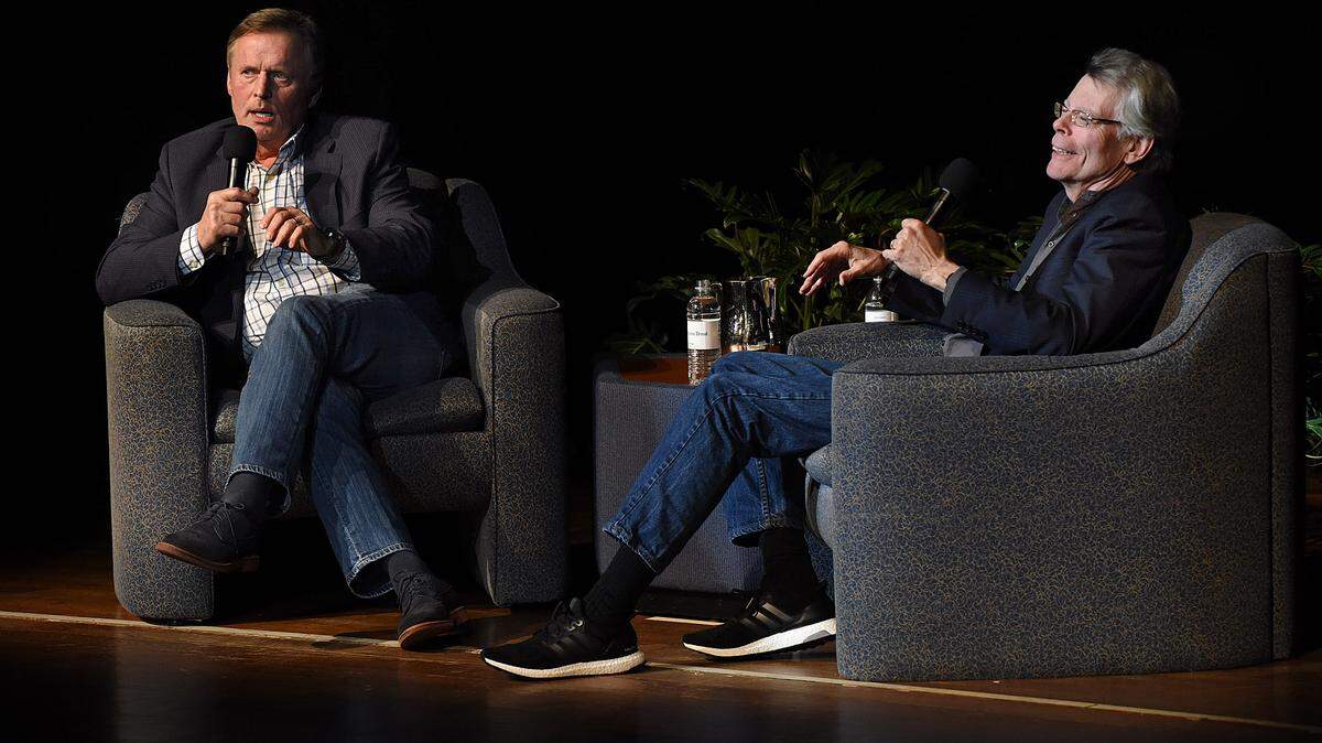Authors John Grisham and Stephen King swap stories on stage at Neel Performing Arts Center at State College of Florida Tuesday night as a fundraiser for the Manatee Library Foundation. 
 TIFFANY TOMPKINS-CONDIE/Bradenton Herald