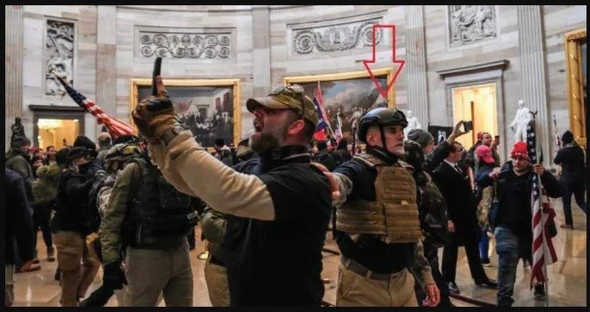 The U.S. Department of Justice says Graydon Young, a member of the Oath Keepers militia who lives in Englewood in Sarasota County, participated in the U.S. Capitol riot on Jan. 6. Federal prosecutors have charged him with conspiracy and other crimes The red arrow points to Young.