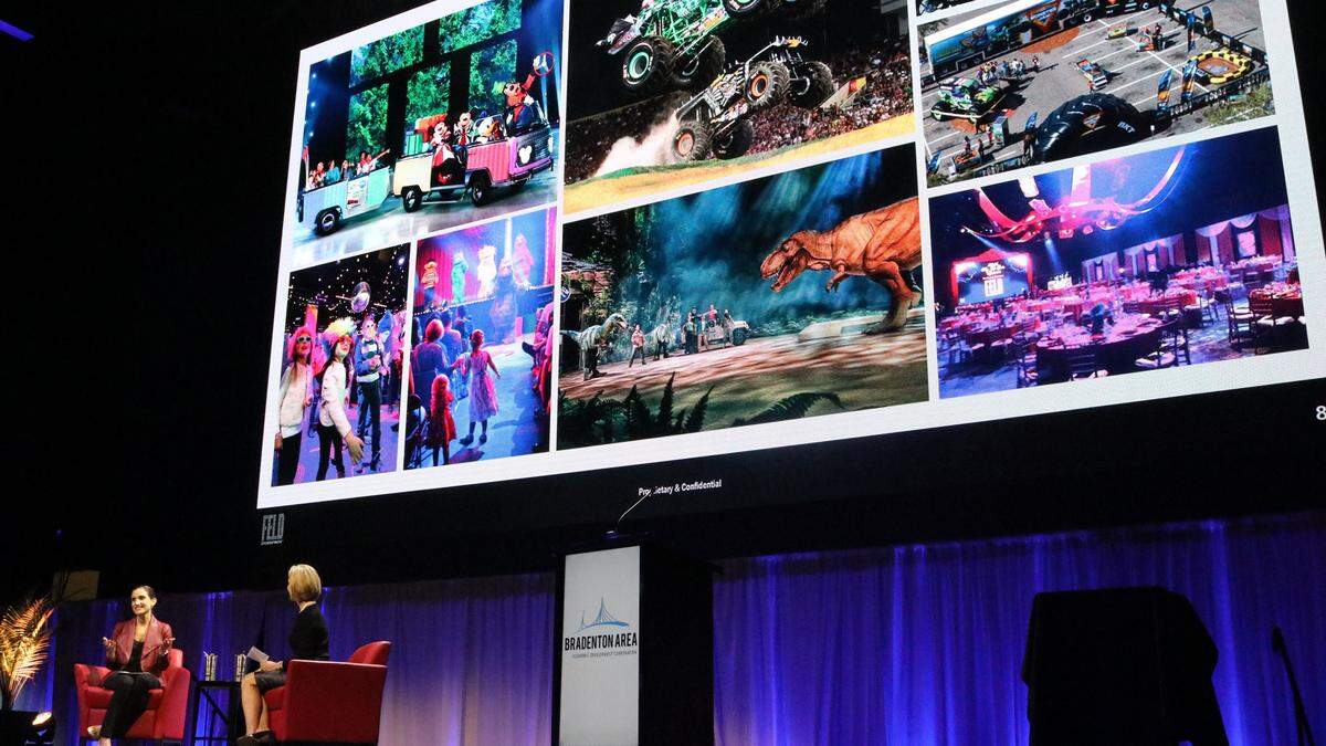 Sharon Hillstrom, right, and Juliette Feld Grossman had an onstage dialogue about the entertainment giant Thursday during the Bradenton Area Economic Development Corporation annual update. They are sitting under a giant screen showing iconic Feld traveling shows.
