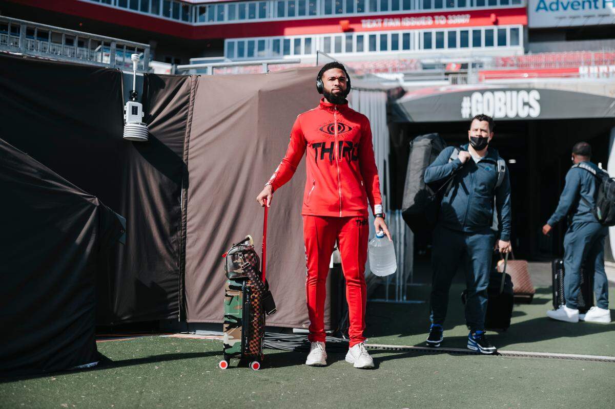 Keith Kirkwood of the New Orleans Saints, formerly of the Carolina Panthers, arrives at Raymond James Stadium in Tampa, where the Panthers played the Tampa Bay Buccaneers in 2021. He is wearing a sweatsuit from Brent Yancy’s 3RD collection, which Yancy designed to tailor to athletes.