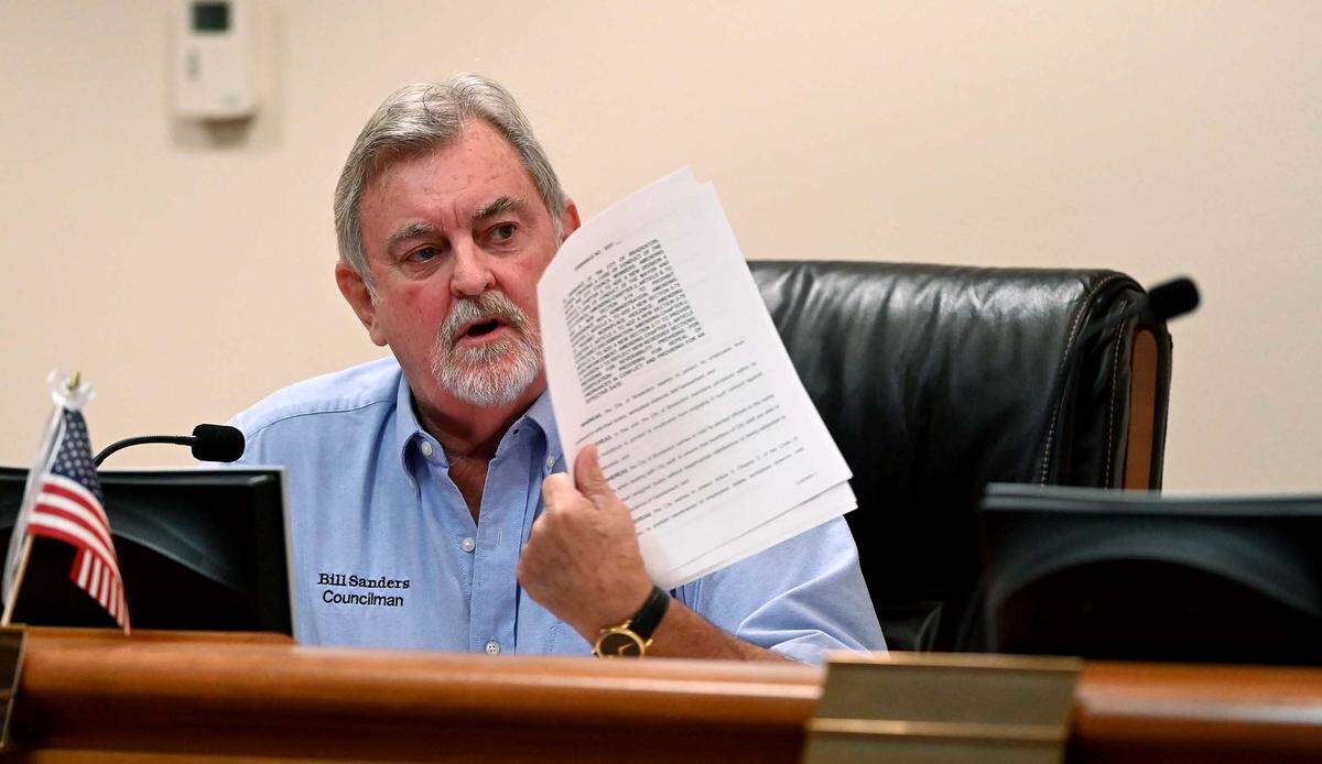 Councilman Bill Sanders holds up a proposed ordinance that would allow the city to pursue legal action against any council member that violates the city’s code of conduct policy during a Bradenton City Council workshop Wednesday, Oct. 19, 2022 Sanders argued that the proposal is a “violation of election laws” and an attempt to “neuter the board.”