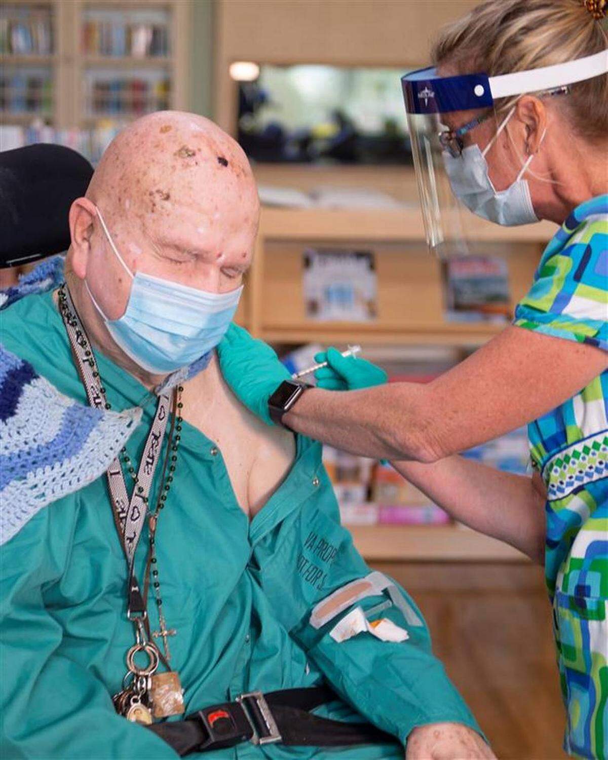Navy veteran William German, 95, receives the vaccine for COVID-19 at Bay Pines VA in December.
