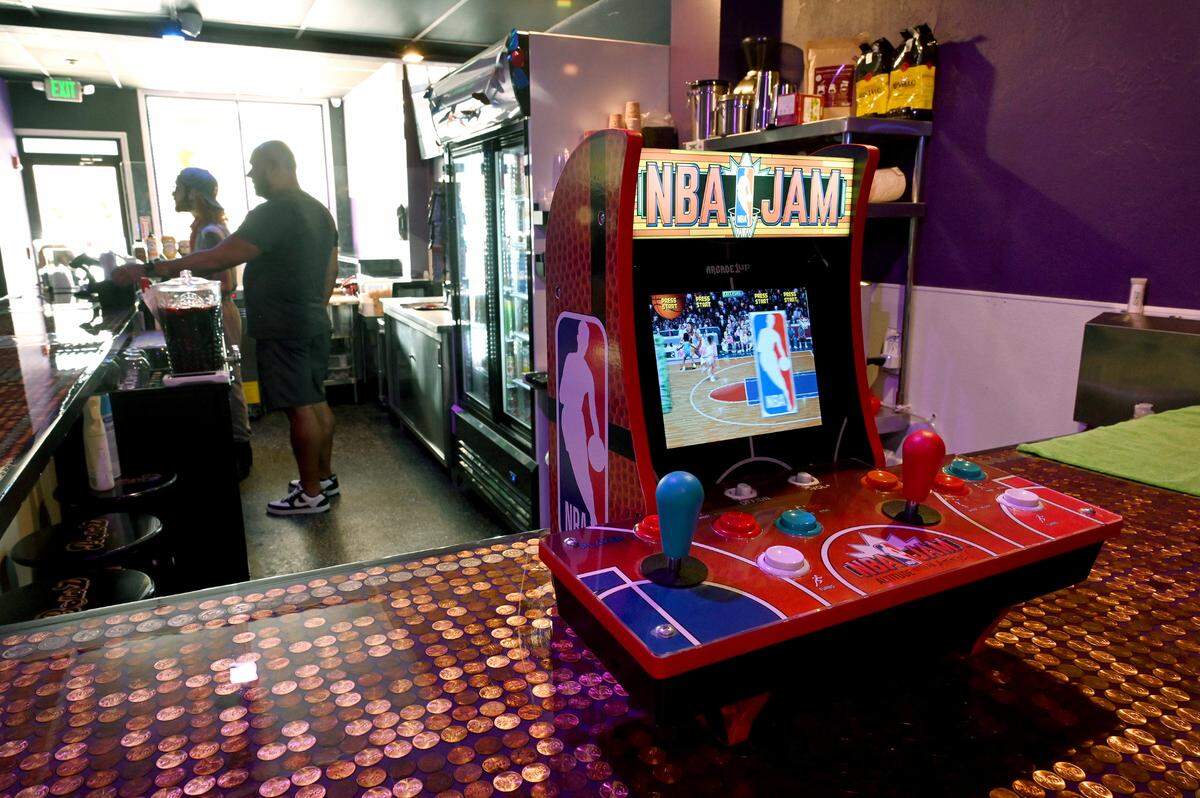 The counters at Ballerz Pinball Cafe in downtown Bradenton are made with hundreds of coins, on July 2, 2025.