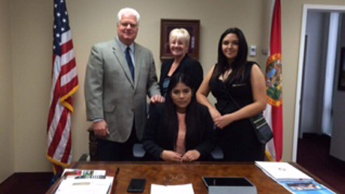 Maria Martinez, seated, Rubi Milan and Brenda Zofrea pose with Secretary of State Ken Detzner during a trip to Tallahassee. PHOTO PROVIDED