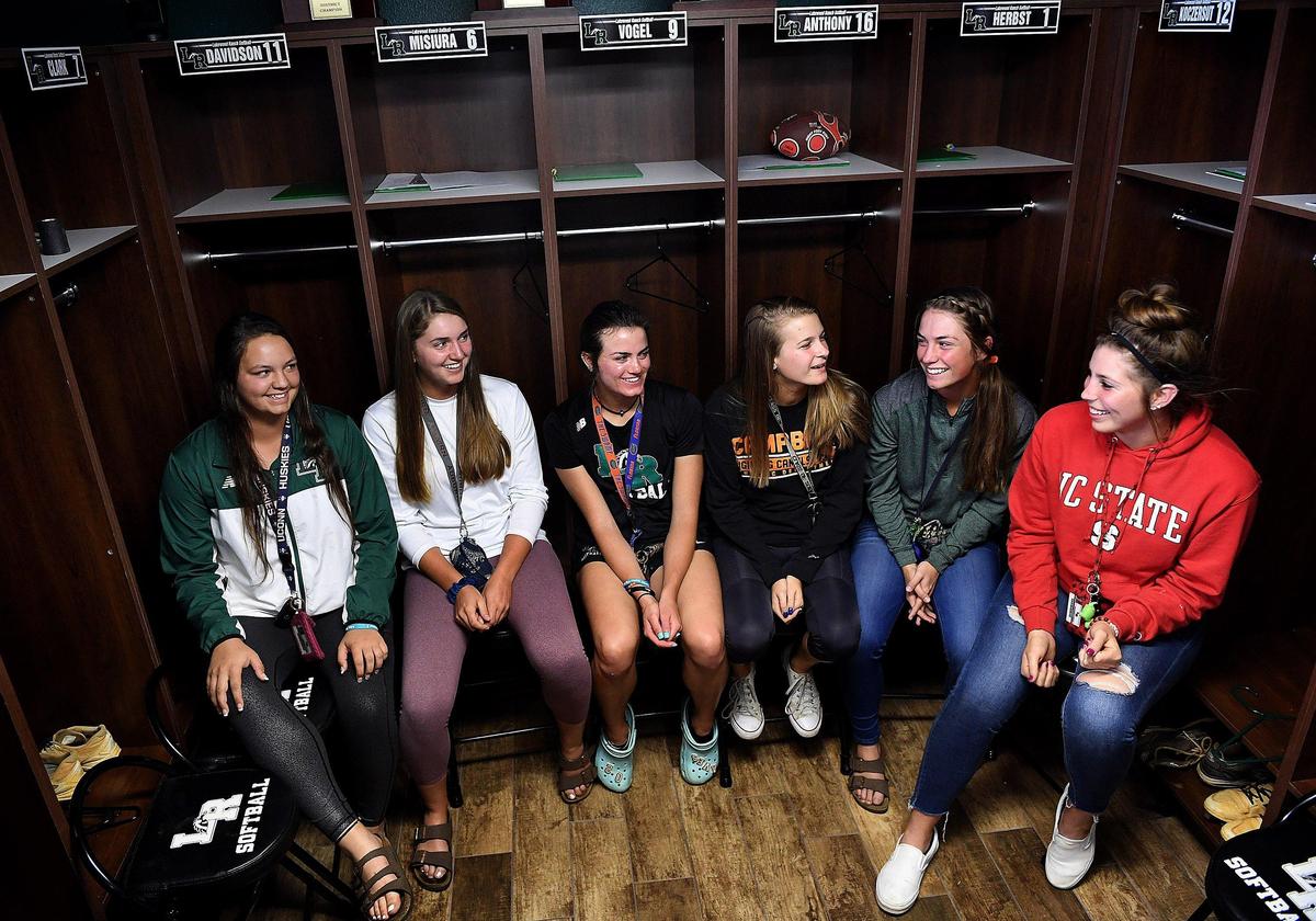 The Lakewood Ranch girls softball team, Payton Kinney, Claire Davidson, Avery Goelz, Kayla Howald, Jill Herbst and Brooklyn Lucero in their locker room before heading out to play a game against Venice.