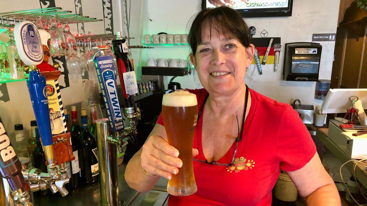 6/16/2021--Simone Kaufer serves a beer at Lucky Frog German Restaurant, 4625 Cortez Road W., Bradenton.