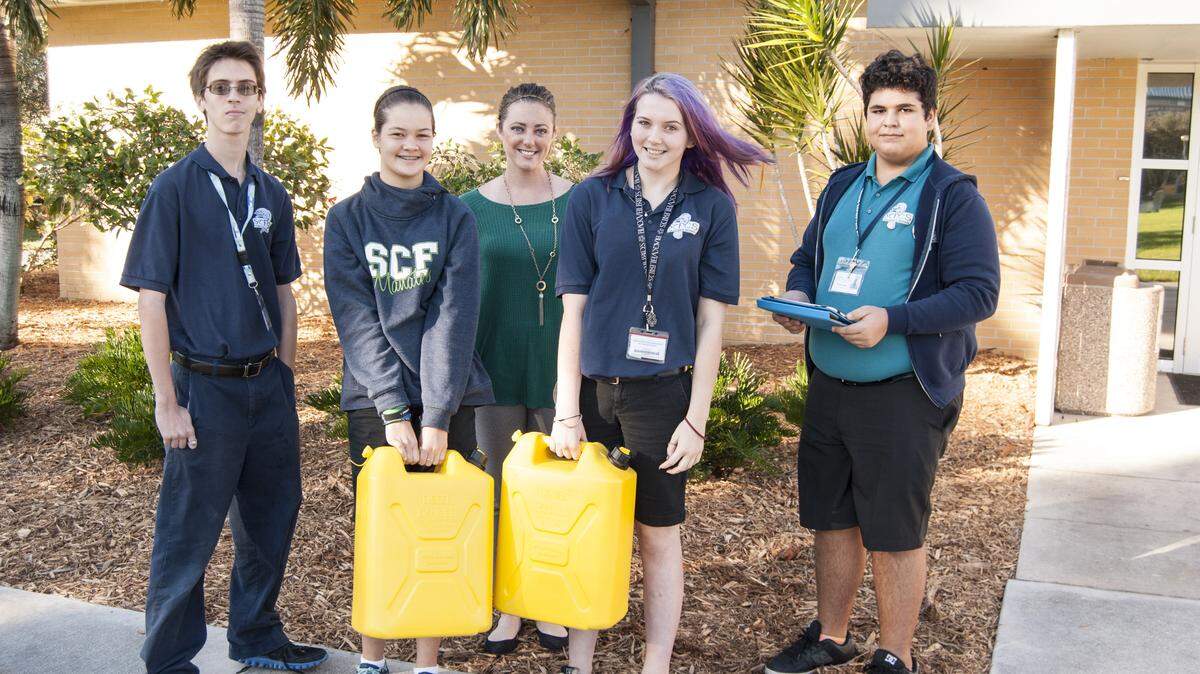 State College of Florida Collegiate School eighth-graders Eric Long, Kea Kamiya, Julie Stivers and Ismael Ruiz with teacher Hannah Cochrane, in back, show the water students carried with them to class. 
 PHOTO PROVIDED