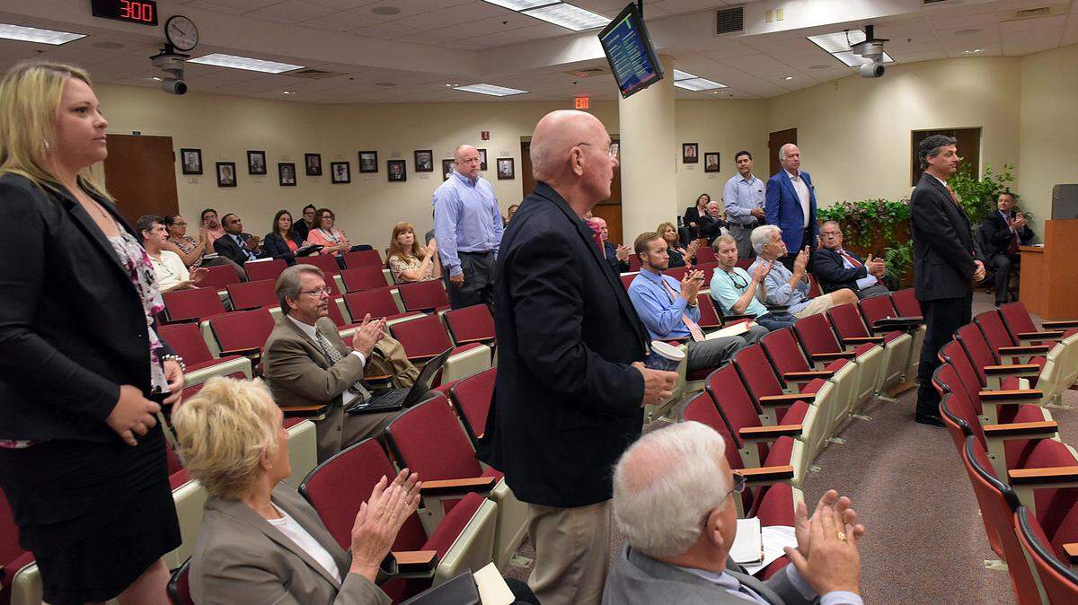 Members of the Citizens Financial Structure Advisory Board stand to be recognizes as they present a report to the Manatee County Commission Tuesday about a half-cent sales tax increase in the county. 
 TIFFANY TOMPKINS/Bradenton Herald