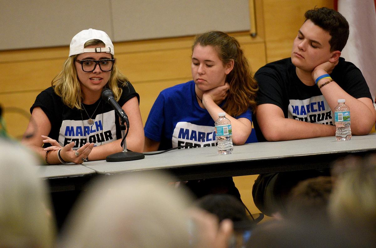 Students from Marjory Stoneman Douglas joined local student activists at a town hall meeting in Sarasota at Selby Library Wednesday. Delaney Tarr, Sarah Chadwick and John Barnitt respond to questions from the audience.