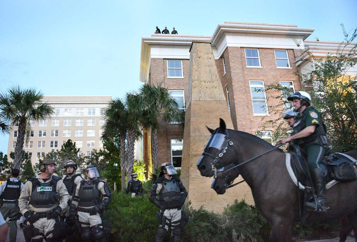 In this Bradenton Herald file photo from August 2017, Manatee County Sheriff’s deputies surrounded the monument which had been covered in plywood.