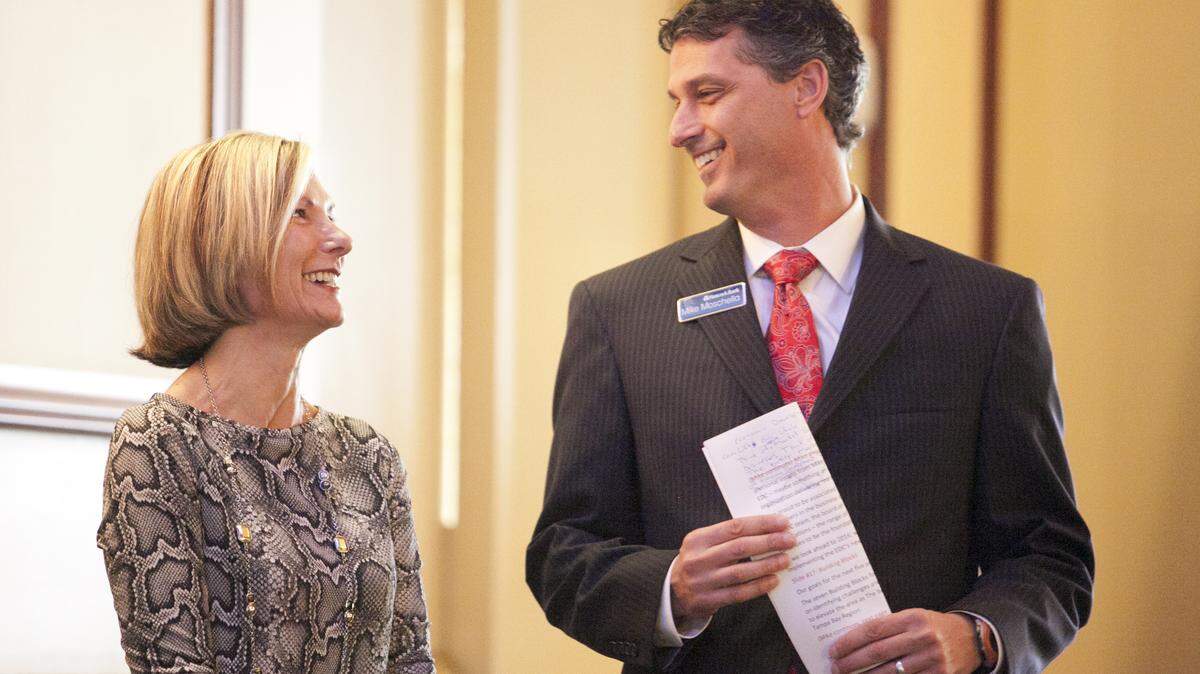 Sharon Hillstrom talks with Mike Moschella, the EDC's incoming chairman, prior to his speech during the organization's update luncheon in Lakewood Ranch Friday. MATT M. JOHNSON/Bradenton Herald