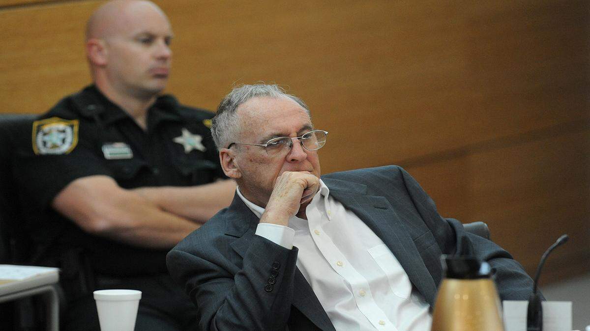 Former Bradenton Police Capt. Thomas Fleming sits at the defense table with his attorney on the first day of jury selection at the Manatee County Judicial Center. Fleming is charged with second-degree murder with a firearm in the death of his wife, Claire, in 2012. 
 TIFFANY TOMPKINS-CONDIE/Bradenton Herald