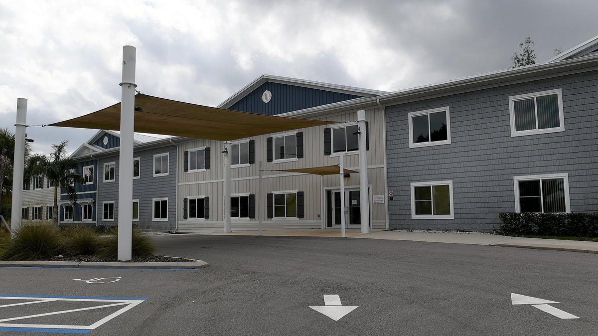 Two years after it was expected to open, the Comfort Cove Senior Care facility sits silent and empty on 14th Street in Bradenton.