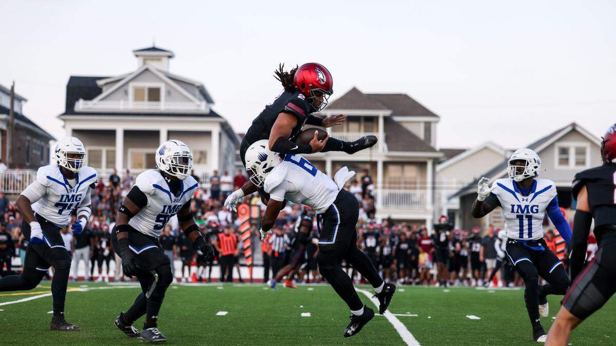 IMG Academy’s Gavin Nix tackles a St. Joseph’s Prep player in this 2023 file photo. Nix is a senior linebacker committed to the Miami Hurricanes.