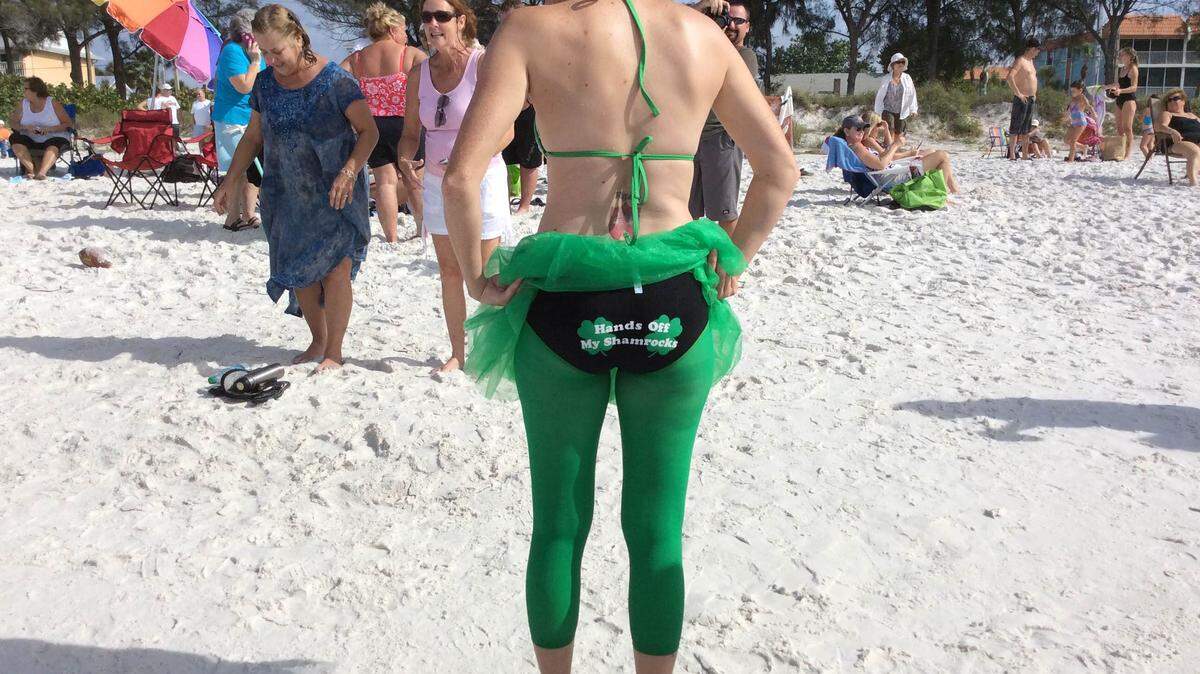 Dana Rothgery, a manager at Clancy's Irish Pub on Cortez Road in Bradenton, shows off her swimsuit after the eighth annual Shamrock Shiver Charity Plunge. MEGHIN DELANEY / BRADENTON HERALD