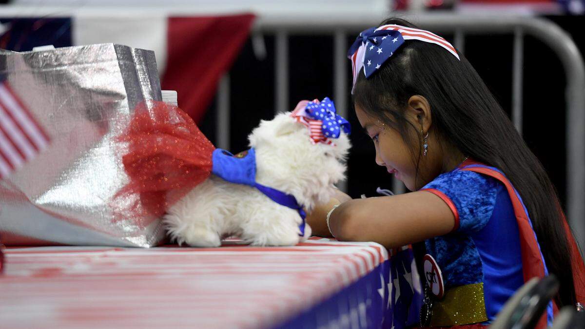 Kora Vongkorad, 6, sits with her stuffed animal as hundreds of Sarasota and Manatee County residents attended a GOP candidate rally at Robarts Arena on Saturday, July 16, 2022, to hear from top Republican leaders.