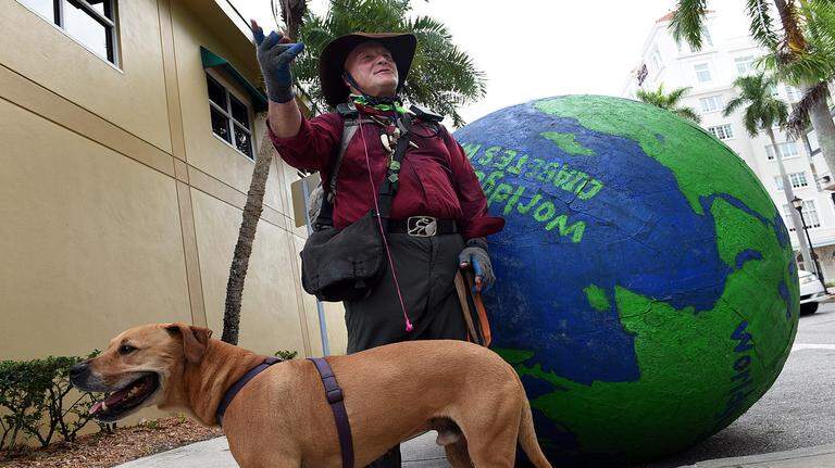 Photo gallery: Man pushes huge globe for diabetes awareness