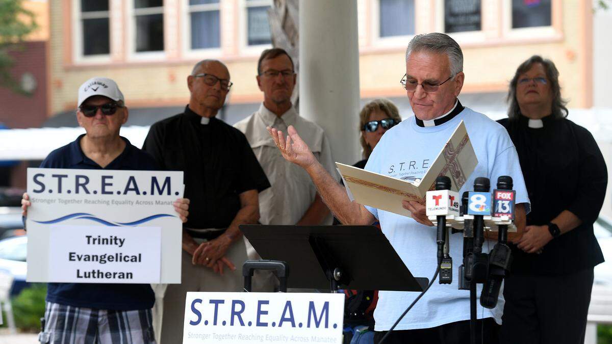 Rev. Glen Graczyk of St. Mary’s Episcopal Church in Palmetto speaks with other faith leaders during a press conference to commend State Attorney Ed Brodsky for adopting a pre-arrest diversion program in Sarasota for non-violent misdemeanors on October 26, 2022. The group of leaders, called STREAM, are calling upon Sheriff Wells to adopt the program in Manatee County.