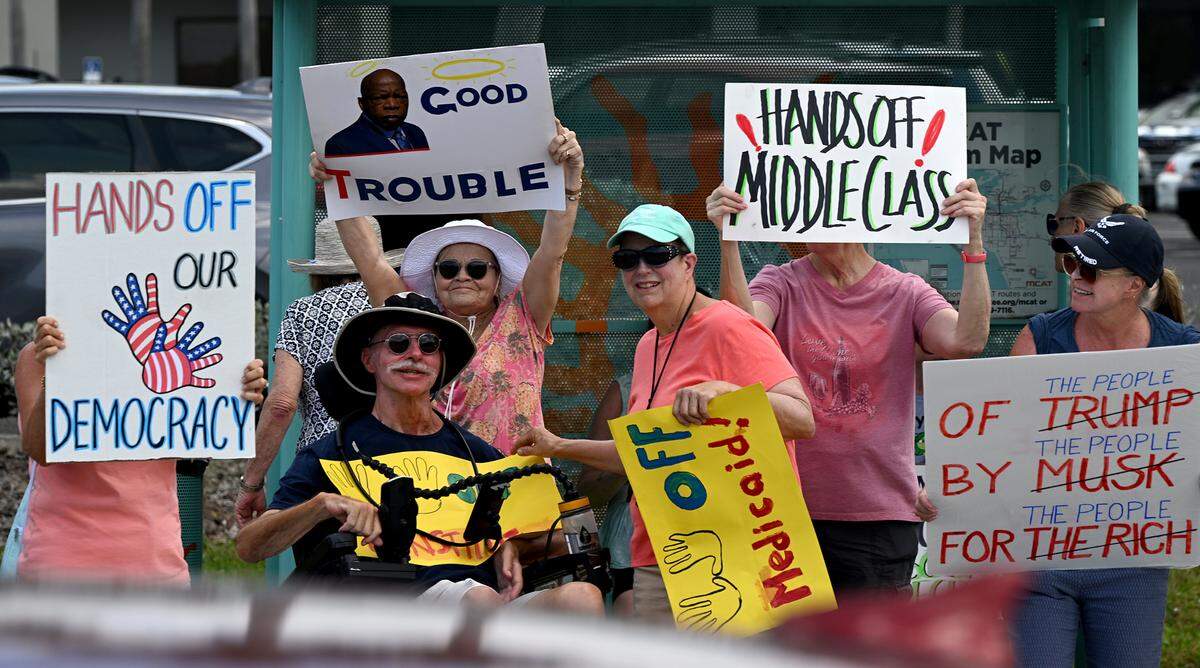 Hundreds of protestors gathered Saturday, April 5, 2025, on Cortez Road West in one of the many national “Hands off” protests against President Donald Trump’s policies.