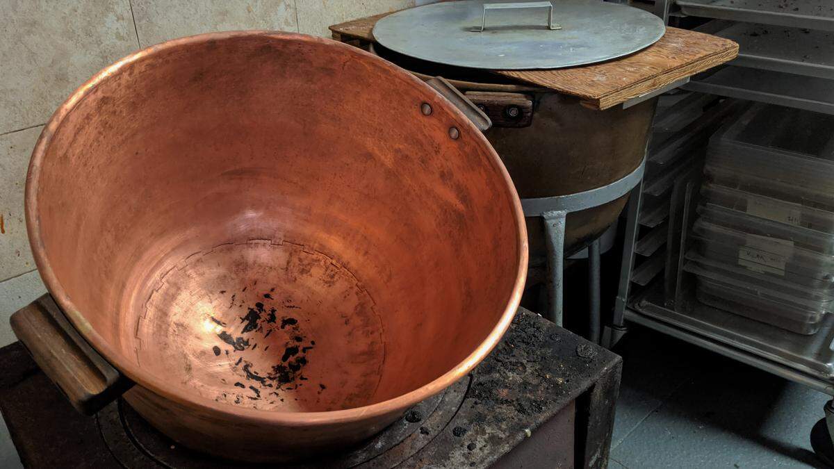 A copper kettle is among the tried and true pieces of vintage equipment used to whip up confections at Richey’s Chocolates in Bradenton.