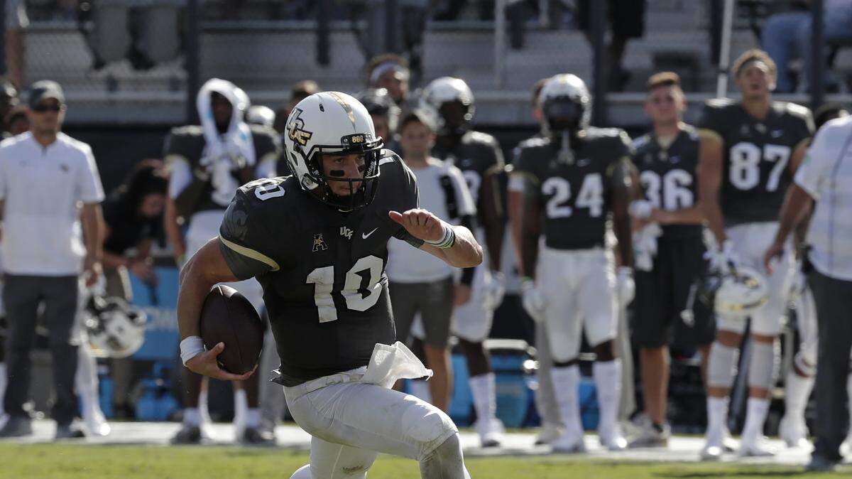 Central Florida quarterback McKenzie Milton runs against Pittsburgh during the first half of an NCAA college football game, Saturday, Sept. 29, 2018, in Orlando, Fla.
