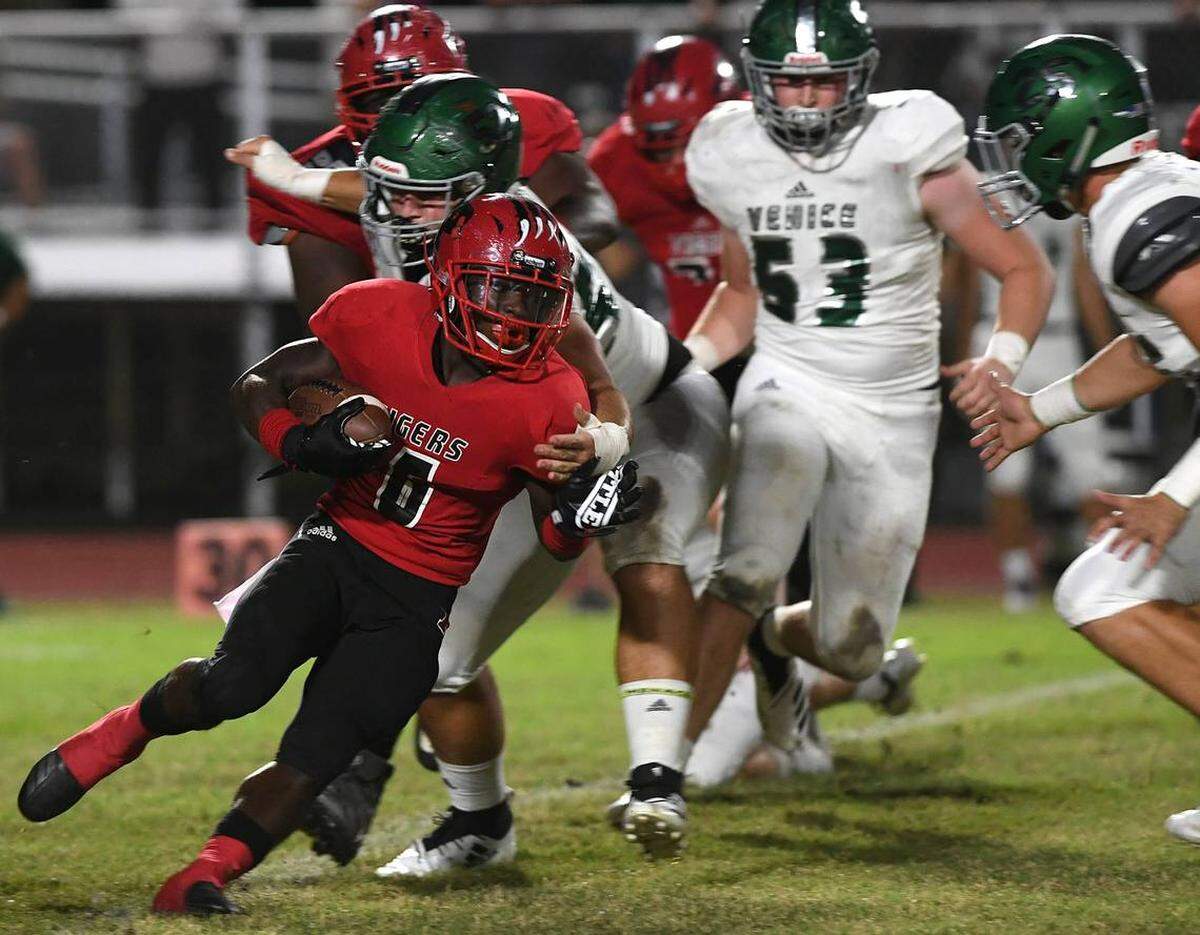 Running back Eddravian Butler and the Palmetto Tigers hit the road to face Punta Gorda Charlotte looking to lock up a playoff berth.
