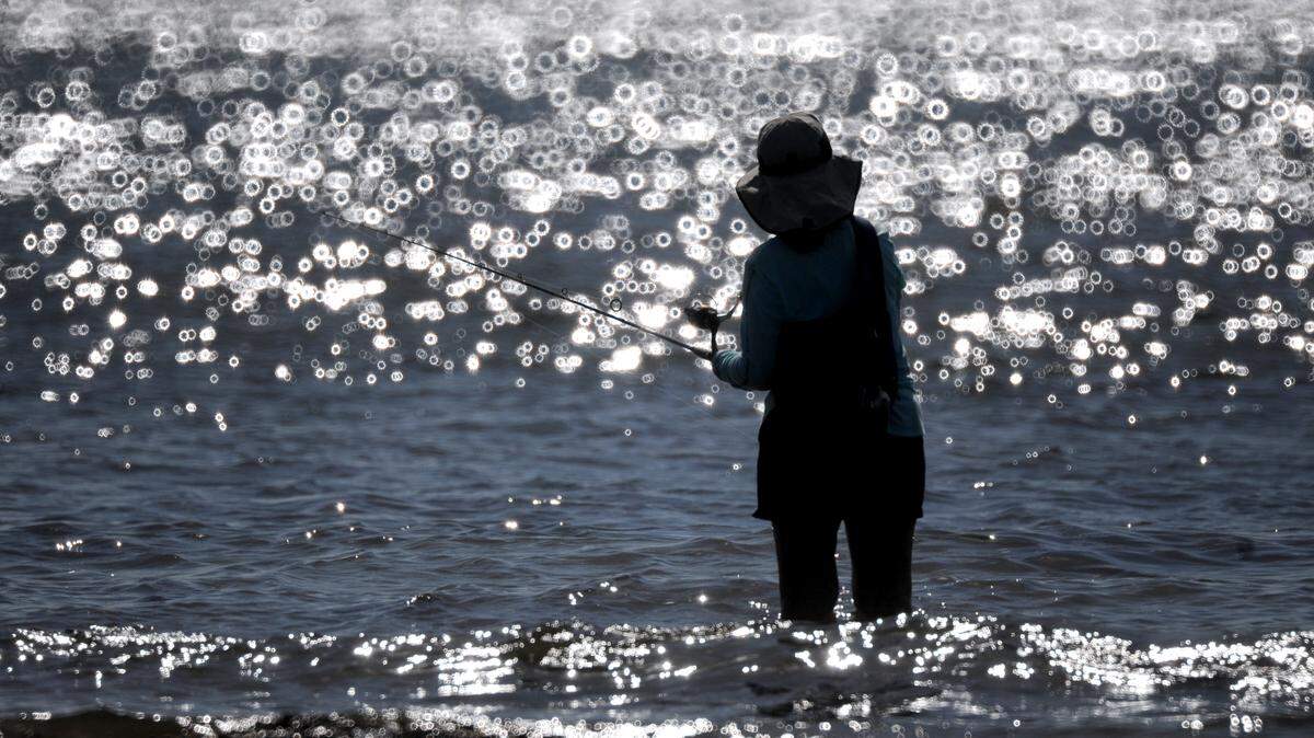 Mary Chow of Canada cast a line into the Manatee River as she fishes Friday off Emerson Point Preserve. 
 GRANT JEFFERIES/Bradenton Herald