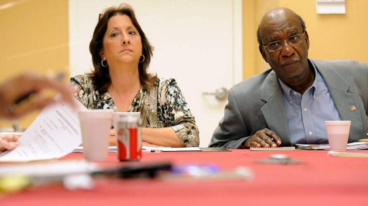 Former Bradenton Housing Authority's Darcy Branch sits with BHA board chairman Napolean Mills at a meeting during her tenure as acting director of the agency following the Wenston DeSue scandal that Branch is credited with bringing to an end. TIFFANY TOMKINS/Bradenton Herald file photo