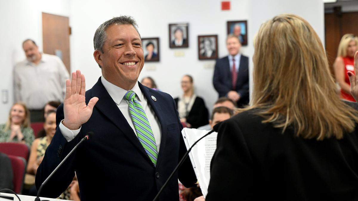 George Kruse is sworn in as Manatee County Commissioner for District 7 by Angel Colonneso during a swearing-in ceremony in the chambers.